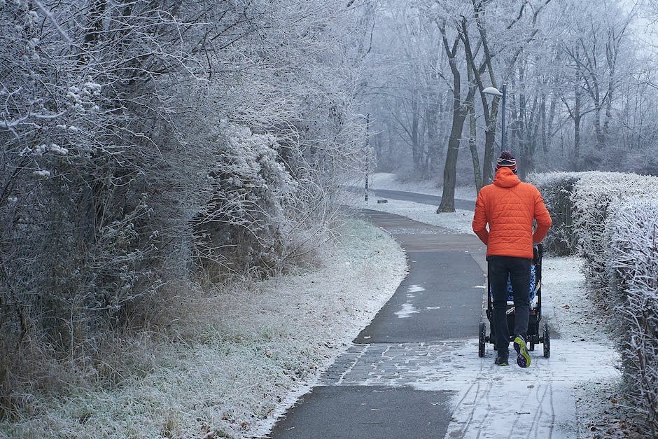 An image of a parent jogging with their child in a stroller