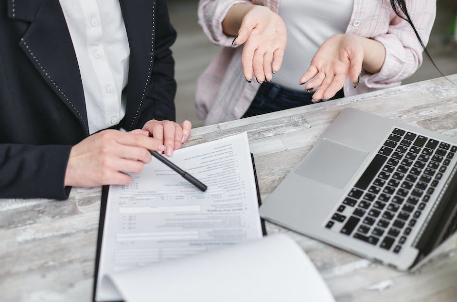 An image of a person holding a life insurance policy document and reading it carefully.